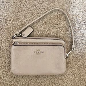 Coach beige leather zip wristlet